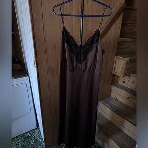 It is a three quarter length dress worn one with v-neck and spaghetti straps